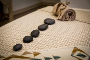 Rainwater Wellness Spa massage and treatment room massage table hot stones